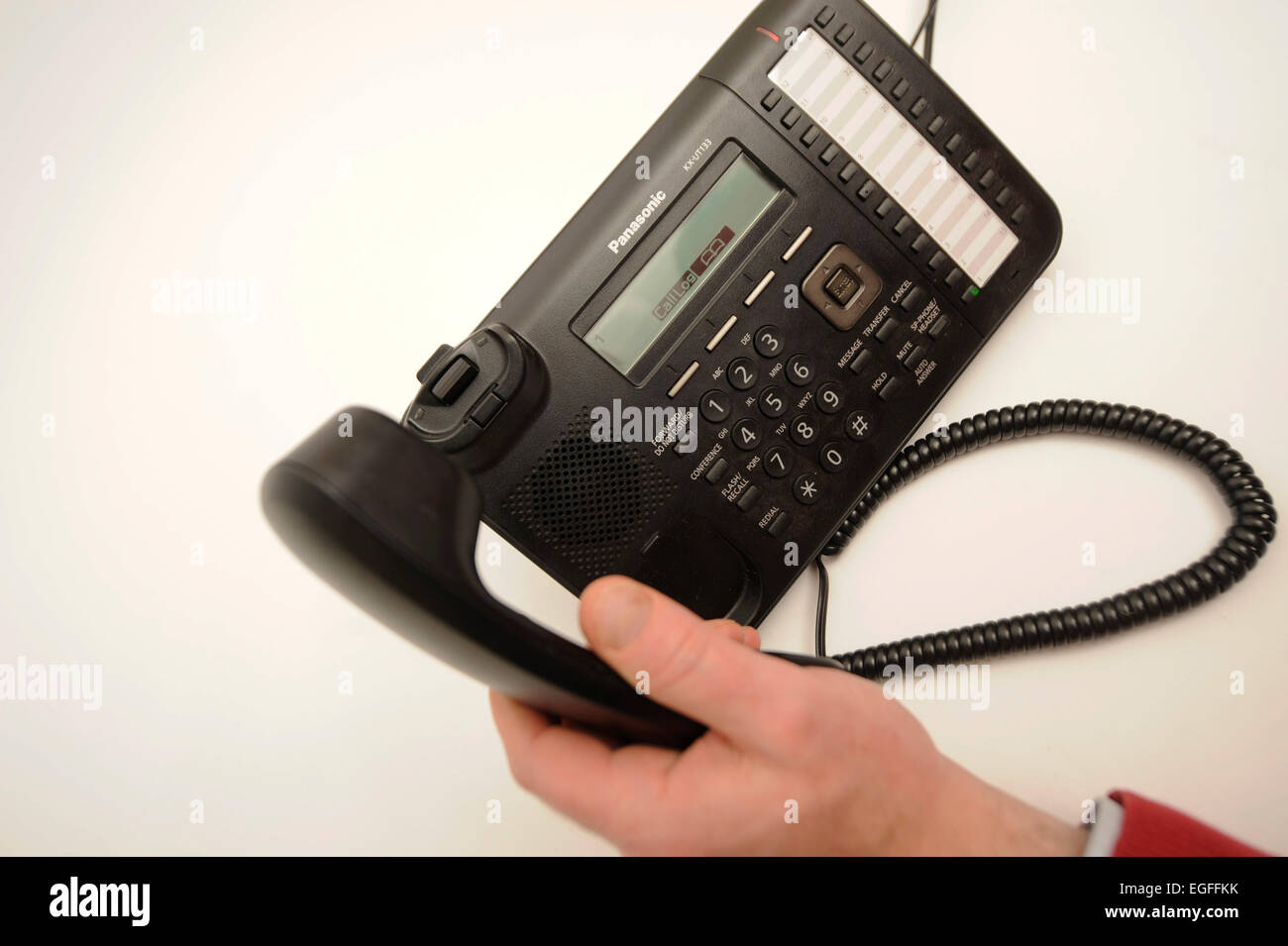 Picking up a Office Phone Stock Photo