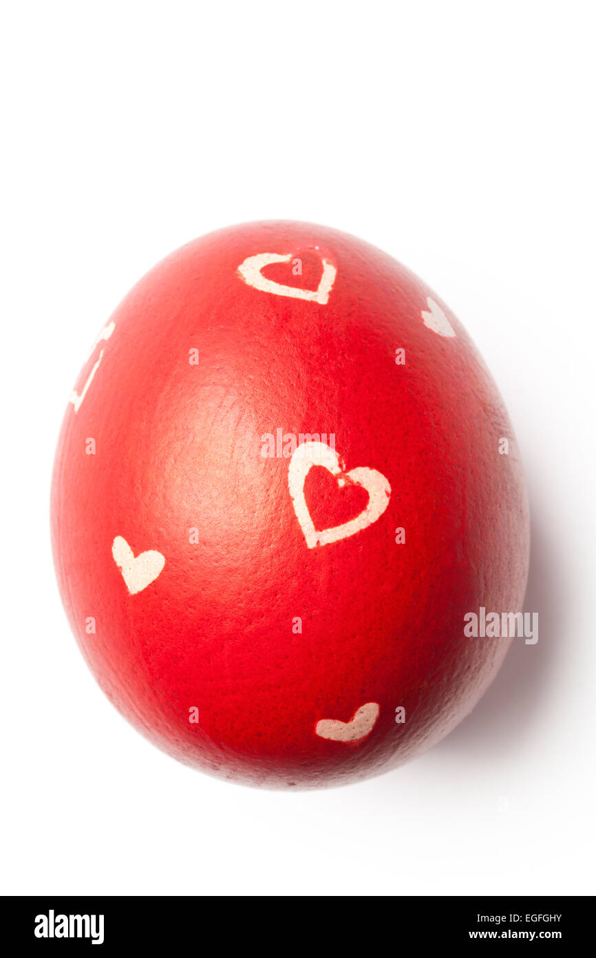 Red painted Easter egg with decorations isolated on white. Image with clipping path. Stock Photo