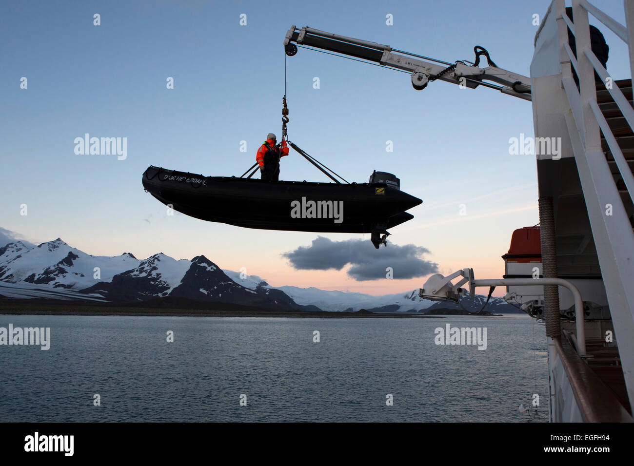 South Atlantic, South Georgia, winching zodiac down into Bay of Isles Stock Photo