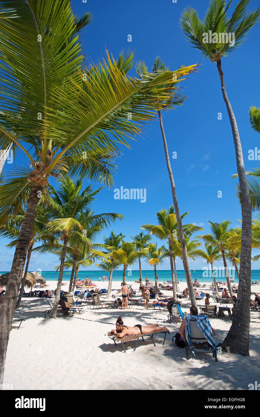 DOMINICAN REPUBLIC. Sunbathers on Punta Cana beach. 2015. Stock Photo