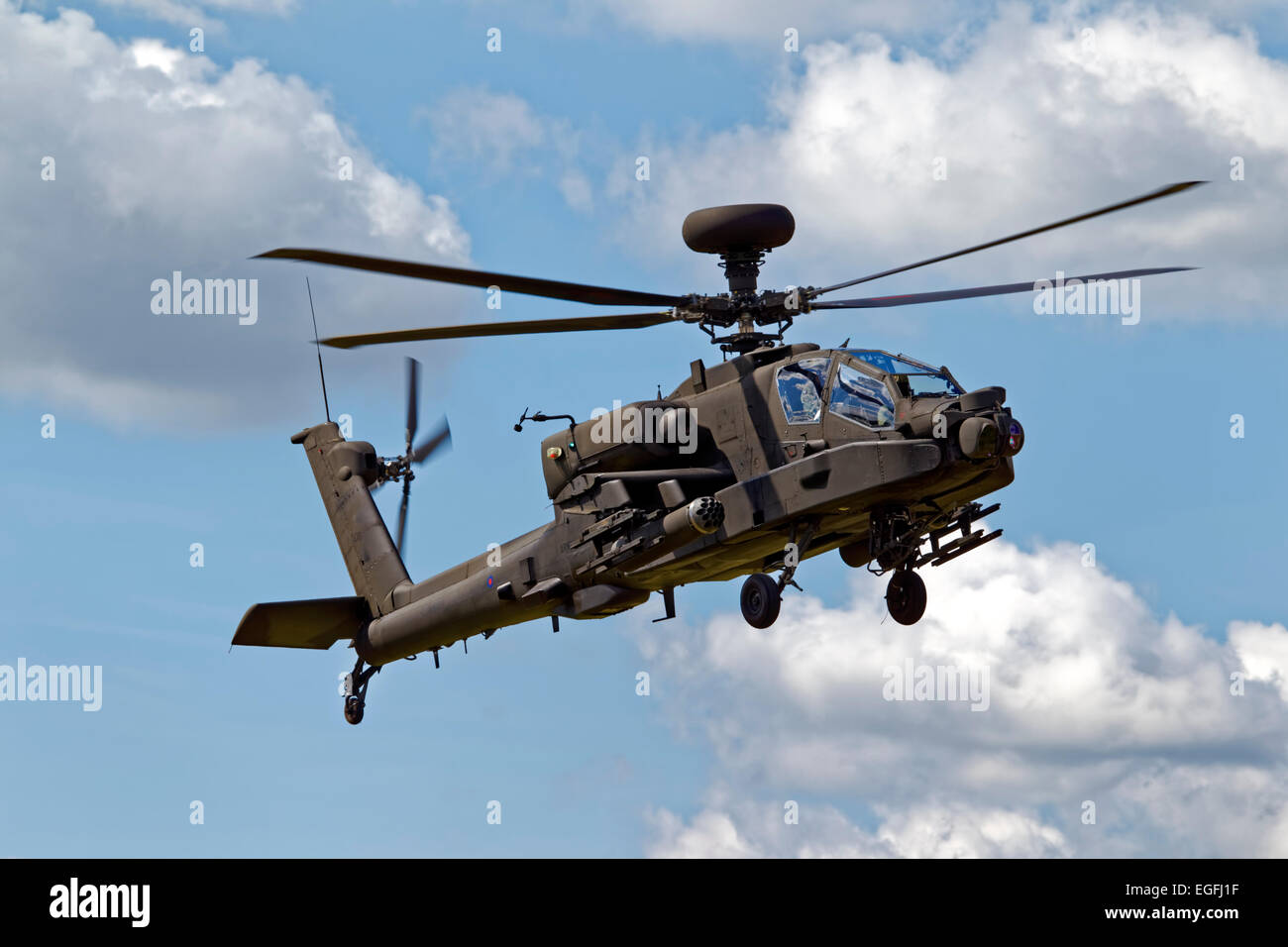 A British Army Air Corps AgustaWestland WAH-64D Apache AH.1 helicopter flies over Salisbury Plain in Wiltshire, United Kingdom. Stock Photo