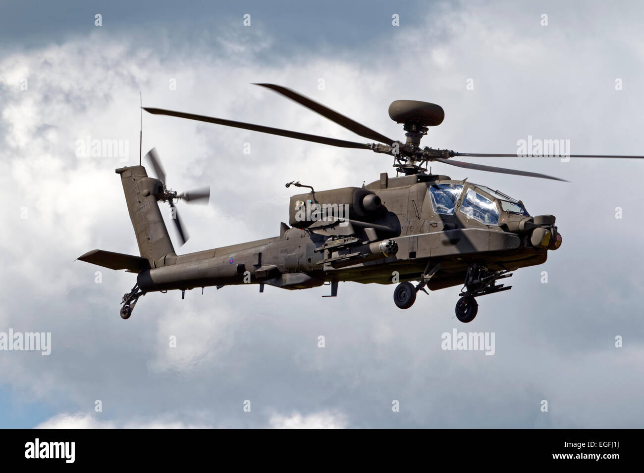 A British Army Air Corps AgustaWestland WAH-64D Apache AH.1 helicopter flies over Salisbury Plain in Wiltshire, United Kingdom. Stock Photo