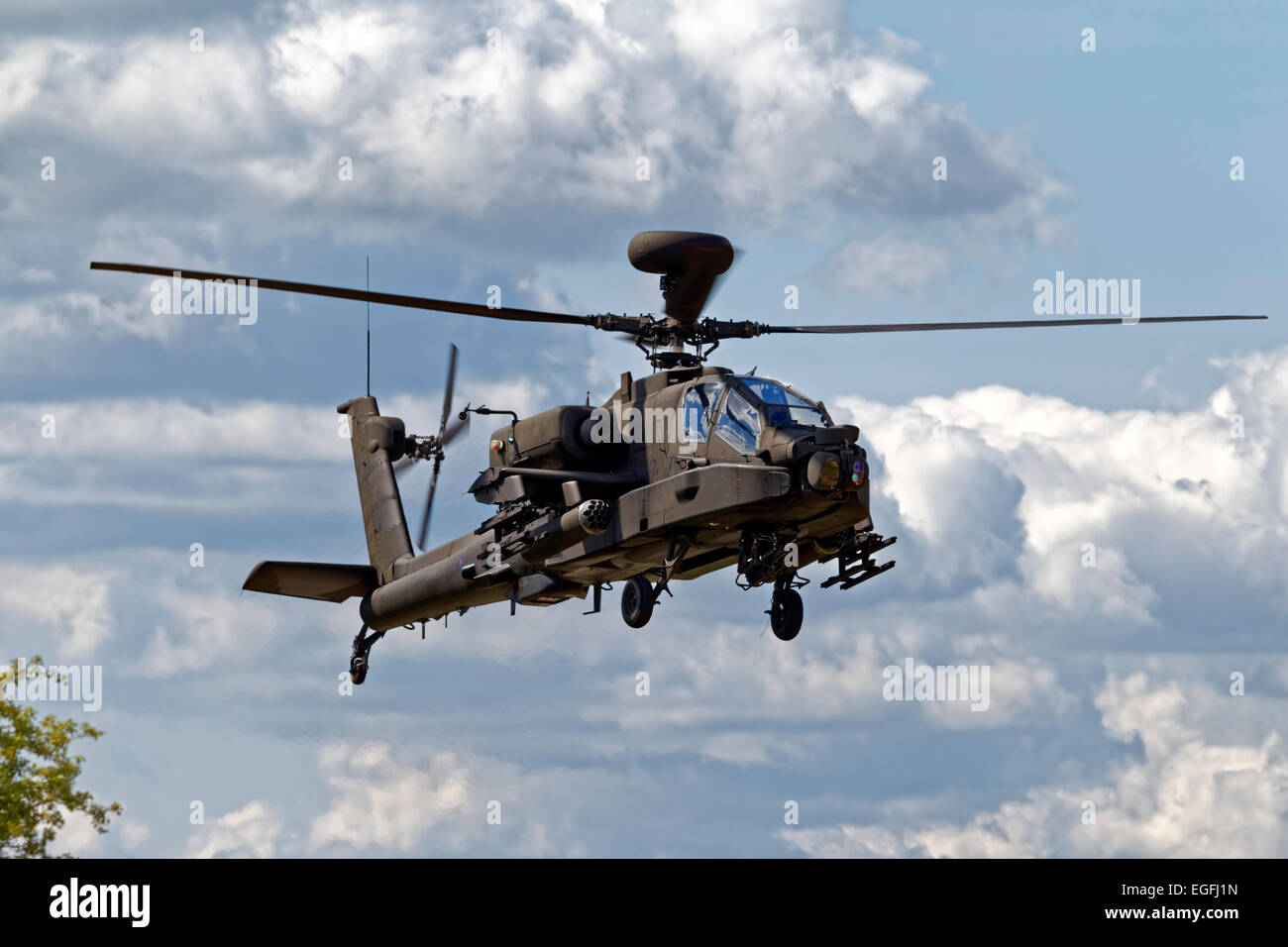 A British Army Air Corps AgustaWestland WAH-64D Apache AH.1 helicopter flies over Salisbury Plain in Wiltshire, United Kingdom. Stock Photo