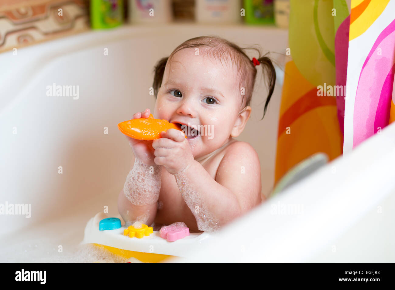 Infant taking a bath hires stock photography and images Alamy