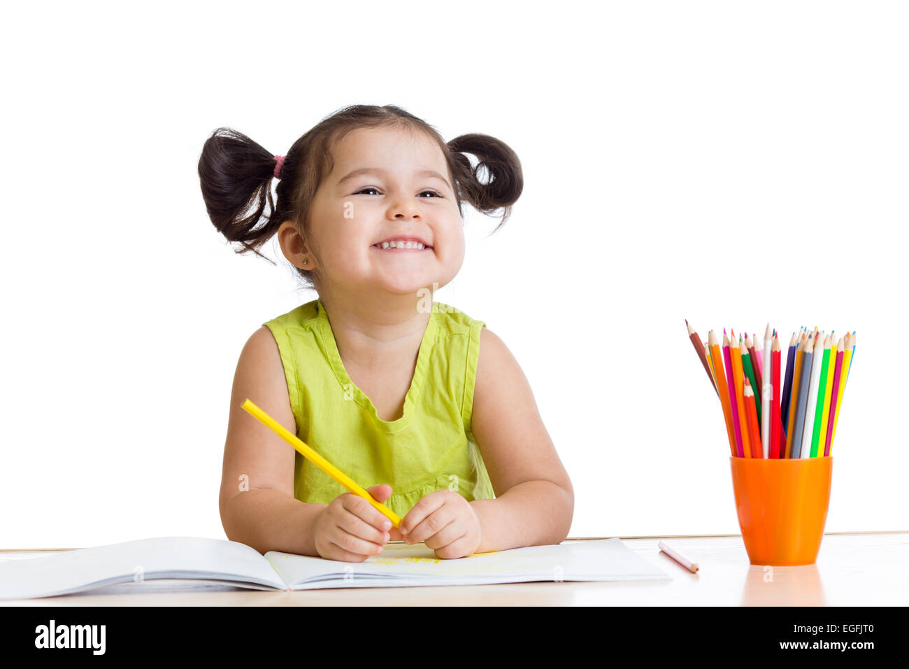 kid girl drawing with colourful pencils Stock Photo