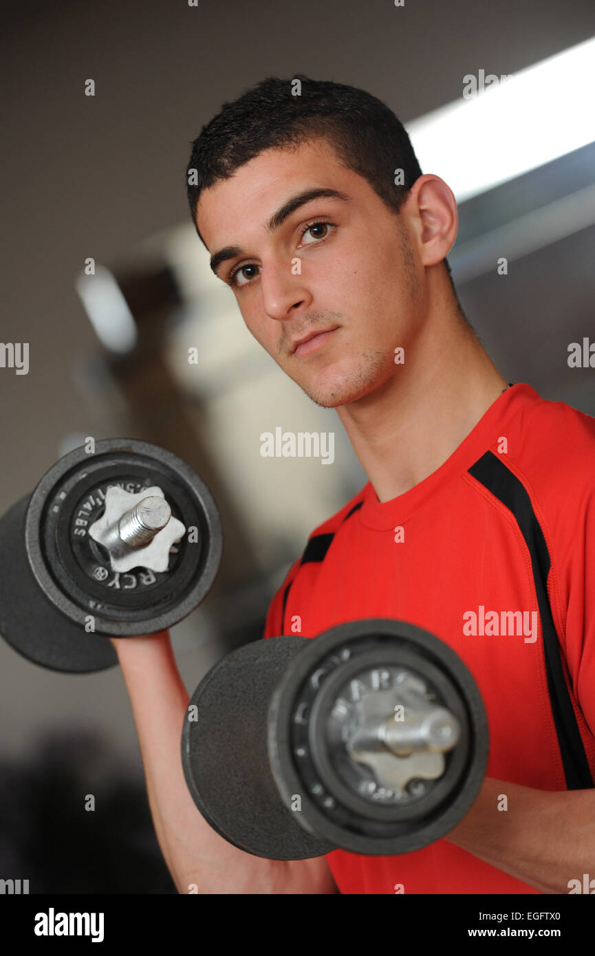 Personal trainer with dumbbells Stock Photo