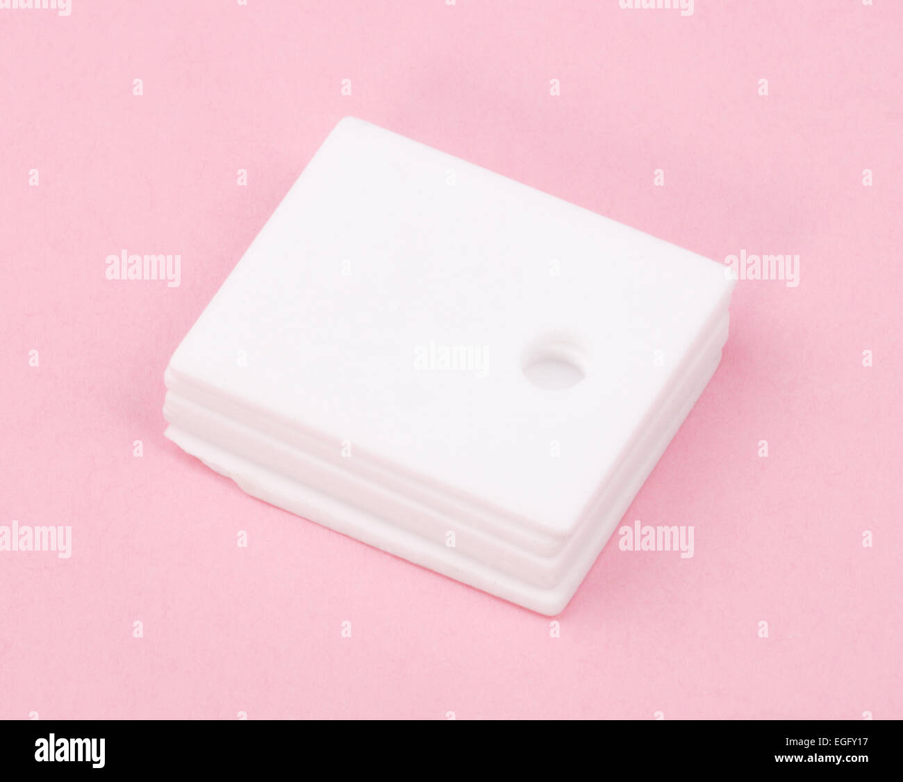 ceramic insulator on Pink Background Stock Photo