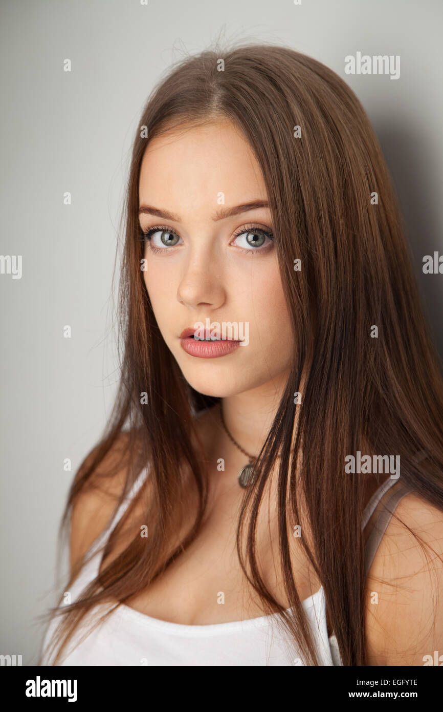 Portrait of a teenage girl with head turned towards camera Stock Photo -  Alamy