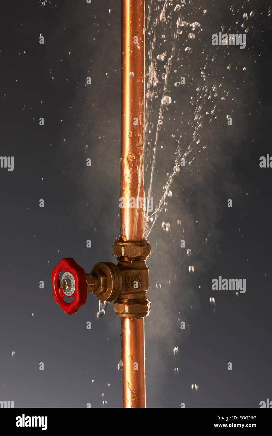 Plumbing burst Leaking Pipe with Tap Stock Photo Alamy