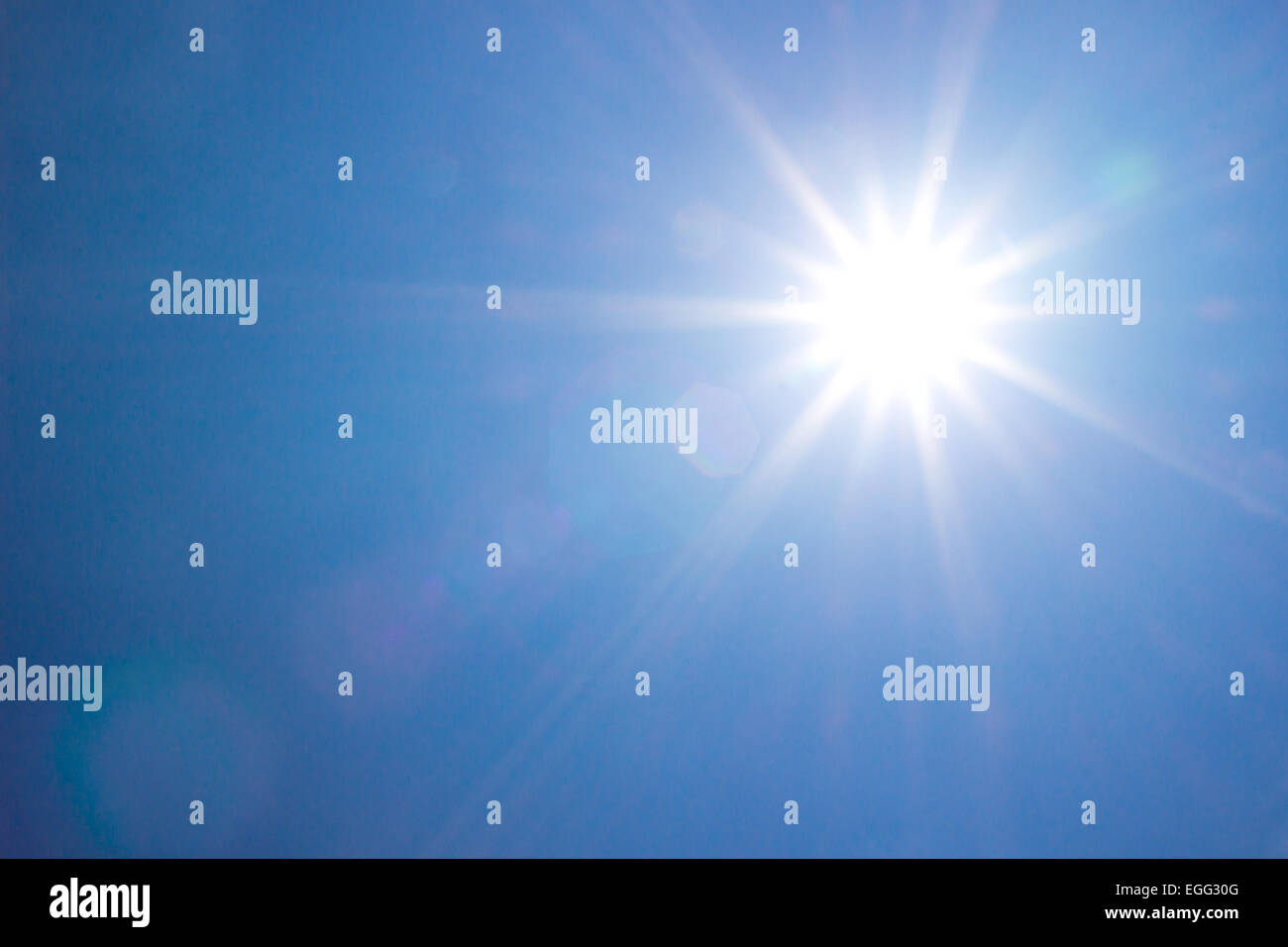 shining sun at clear blue sky Stock Photo
