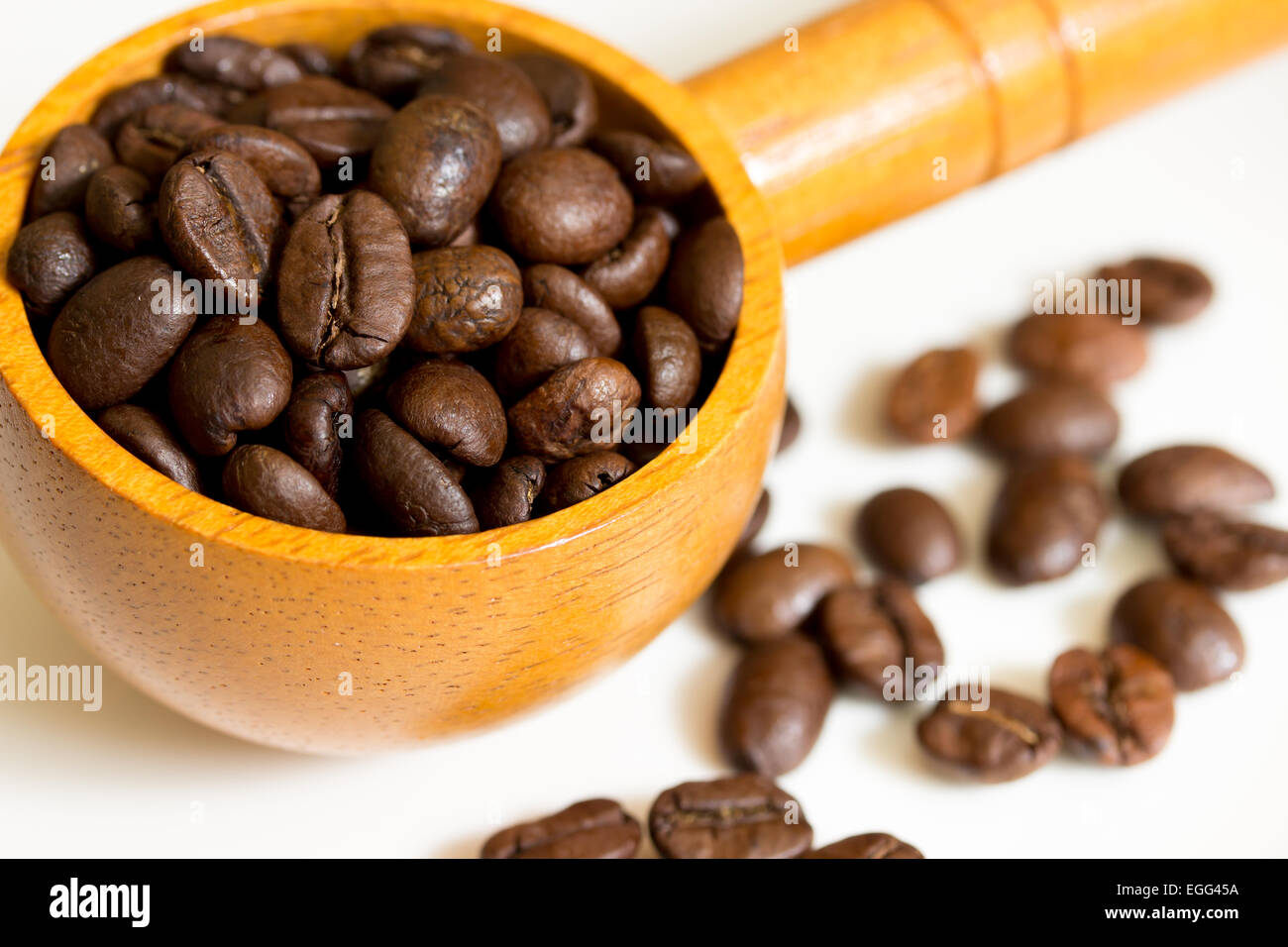 Coffee Beans in wooden spoon on white background Stock Photo - Alamy