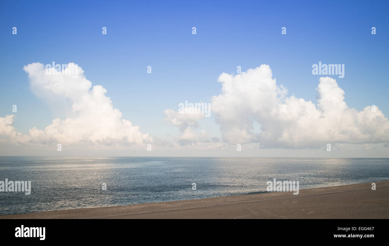 tropical beach blue sky fluffy cumulus clouds Stock Photo - Alamy