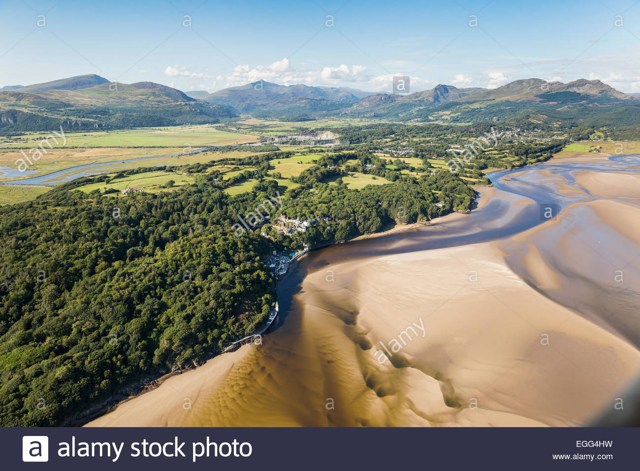 Aerial view of Dwyryd Estuary, Portmeirion Village and hotel, with Snowdon in the distance Stock Photo