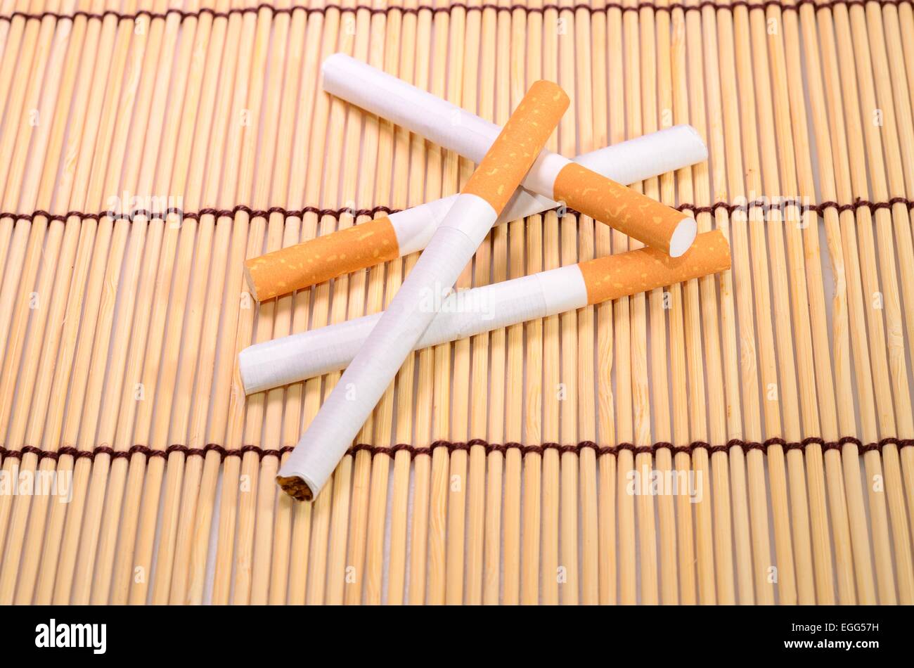 Beautiful Group Of Cigarettes Set Up On Bamboo Mat Stock Photo