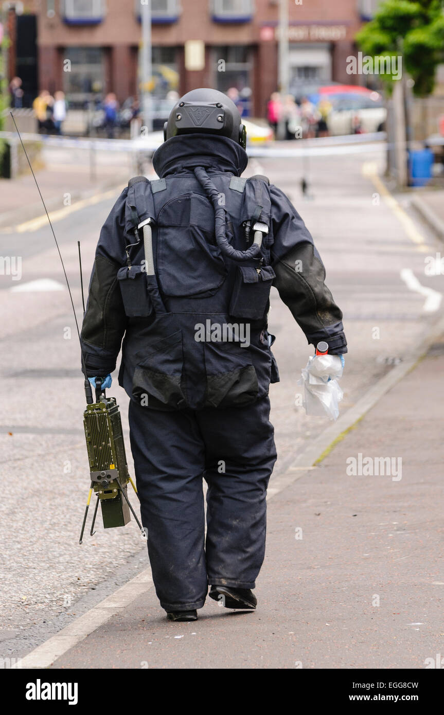 Belfast 02/07/2012 Belfast - Bomb disposal ATO walking back from a suspicious device.  He is carrying an Electronic Counter Measure (ECM) to jam electronic signals which may trigger a device. Stock Photo