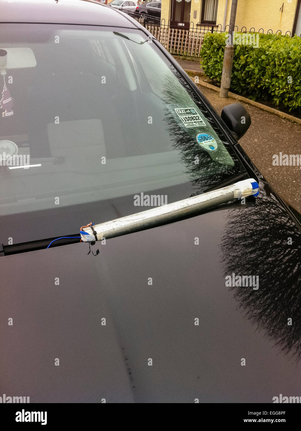 Pipe bomb left on the bonnet of a car, targeting a local community worker Stock Photo