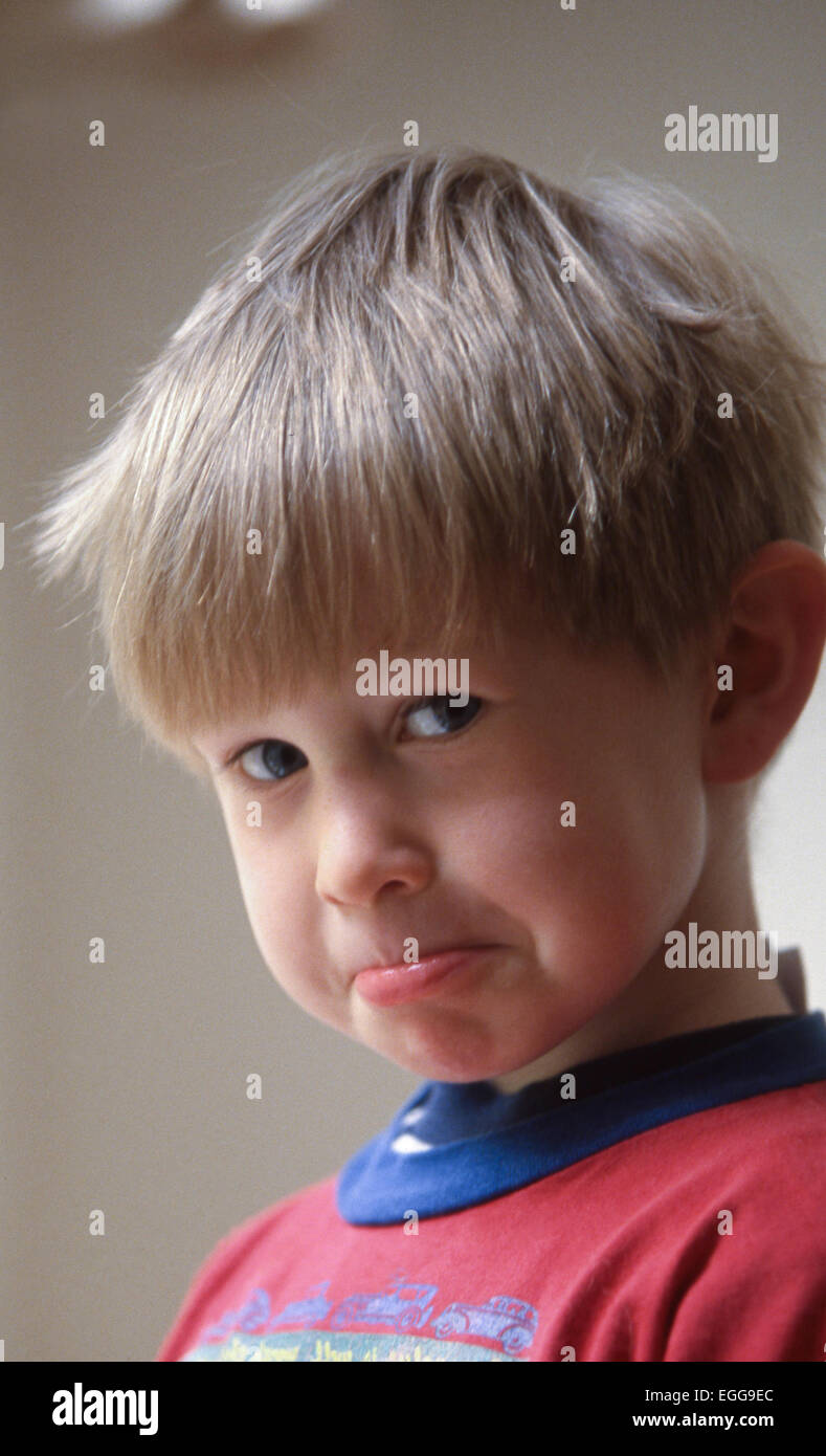 Toddler  male smiles pouts to camera Stock Photo