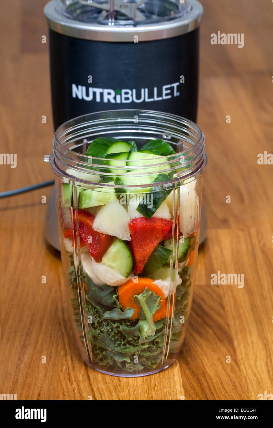 Nutribullet Food Extractor with raw fruit and vegetable ready for