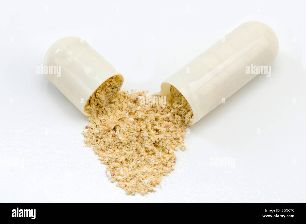 Opened drug Capsule on white Stock Photo