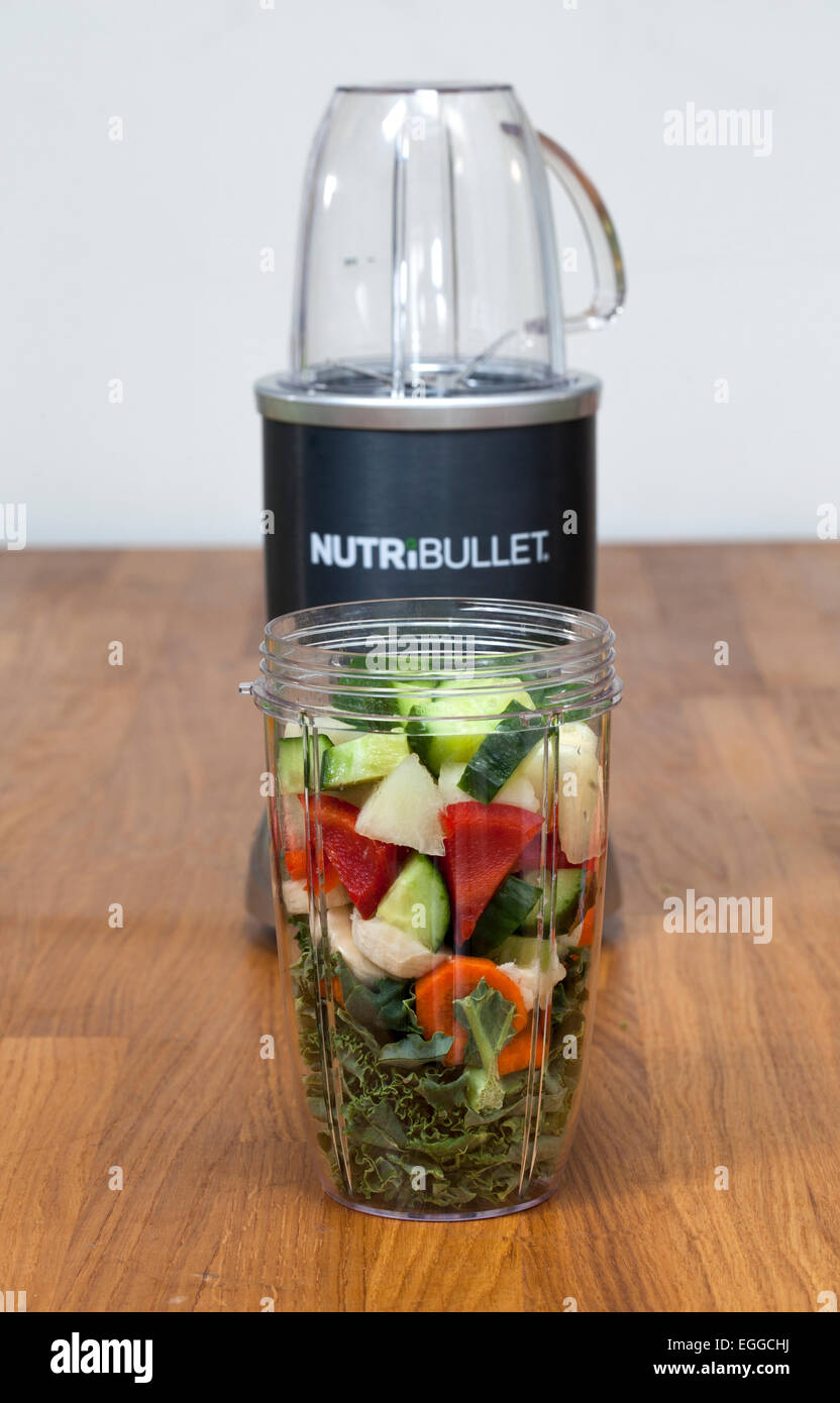 Nutribullet Food Extractor with raw fruit and vegetable ready for extraction Stock Photo