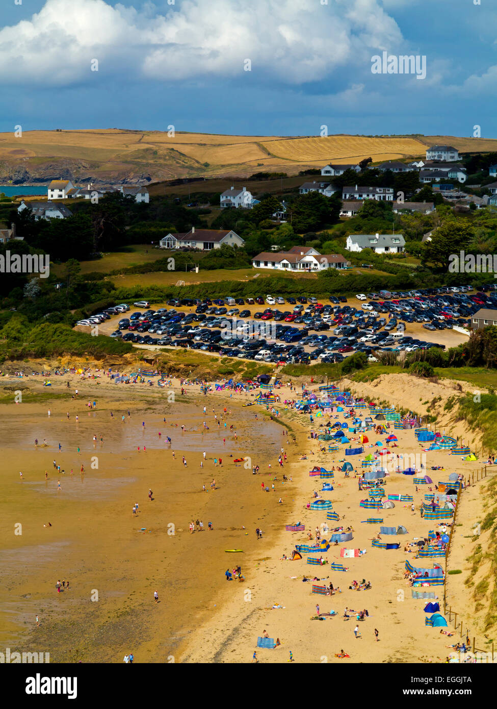 View showing overcrowded beach and car park at Daymer Bay in North Cornwall England UK in August Stock Photo