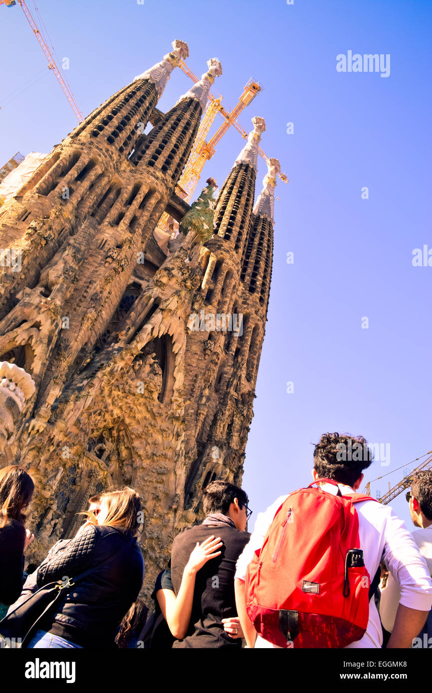 Tourists near the Sagrada Familia facade designed by Antoni Gaudi. Barcelona, Catalonia, Spain. Stock Photo
