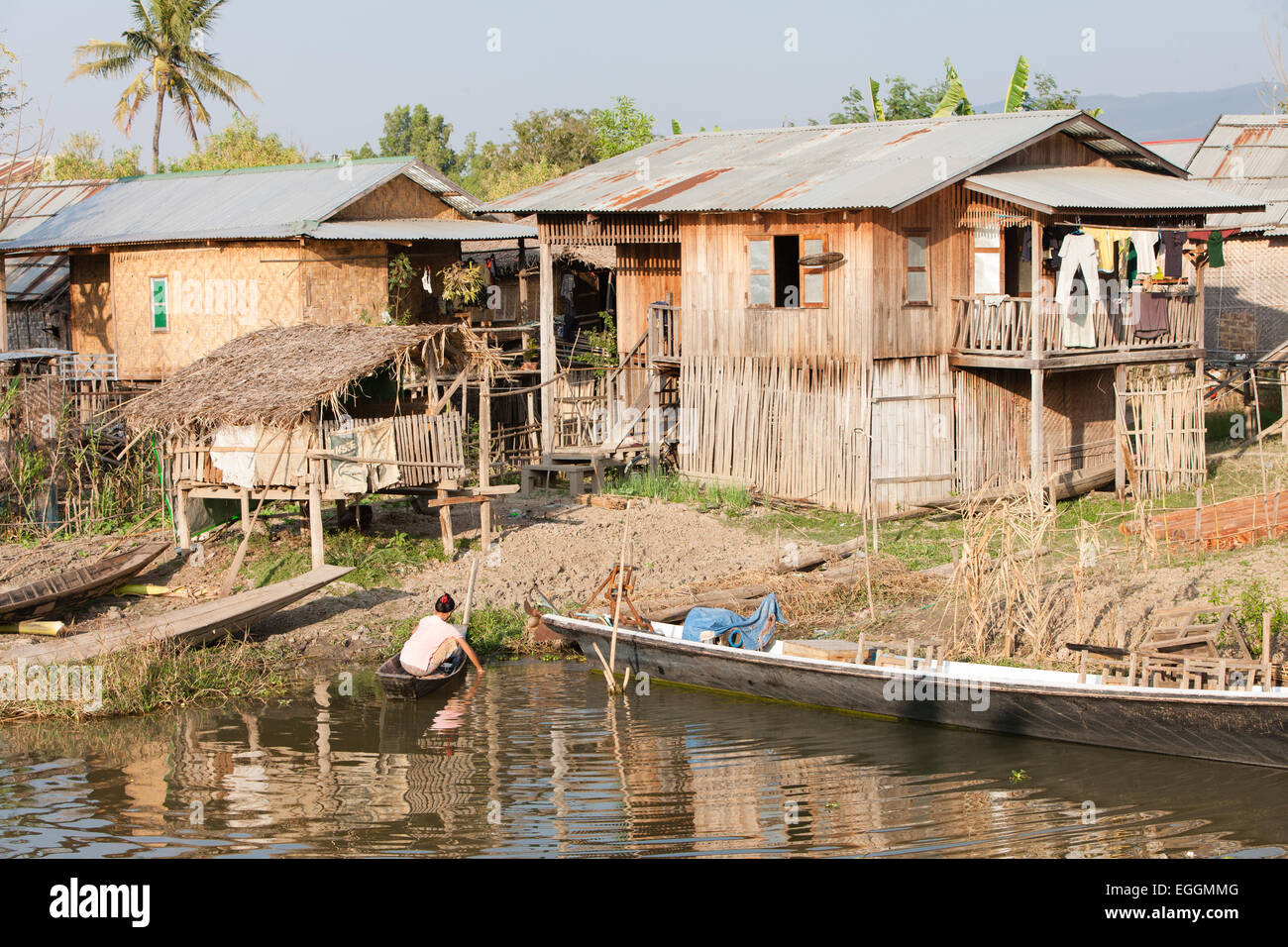 Basic simple houses on canal waterway near main town of Nyaungshwe town on banks of Inle Lake,Burma,Myanmar, Stock Photo