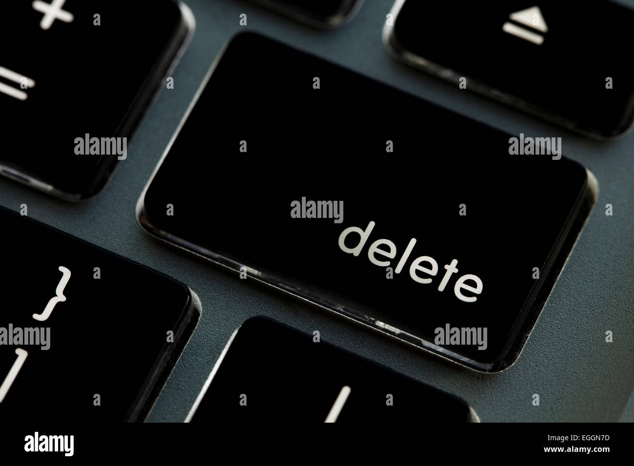 Illuminated Apple Macbook Pro keyboard delete key - USA Stock Photo