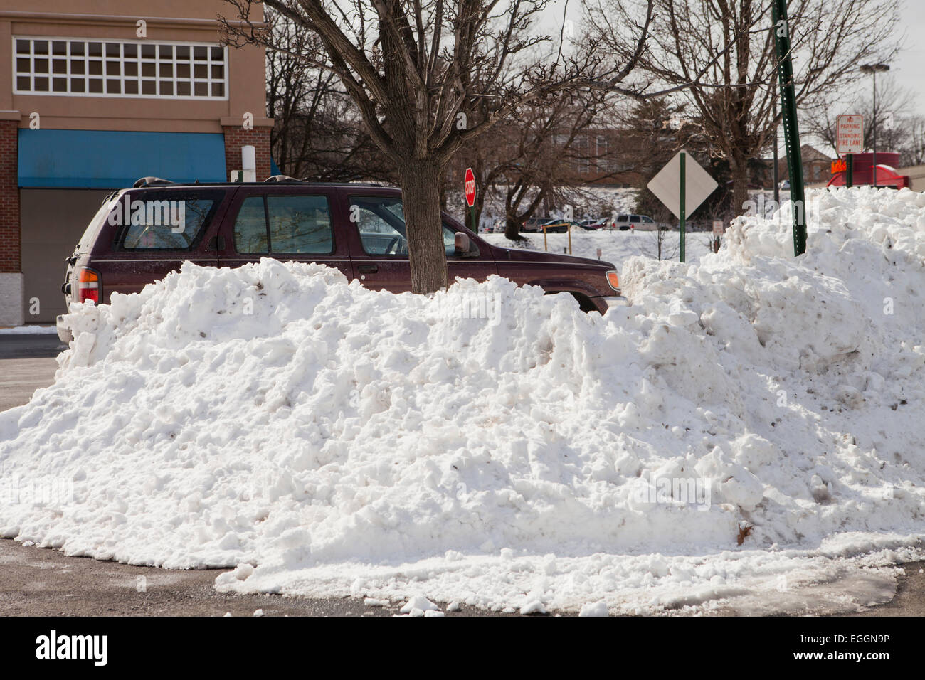 Snow pile on parking lot - Virginia USA Stock Photo - Alamy
