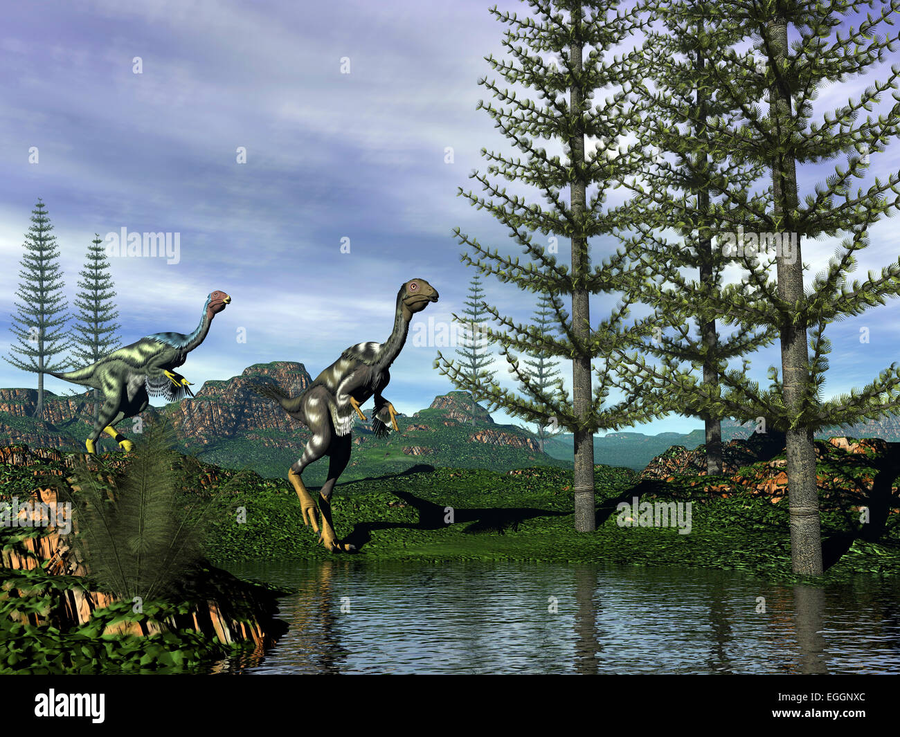 Caudipteryx dinosaurs at the water's edge next to tempskya trees. Stock Photo