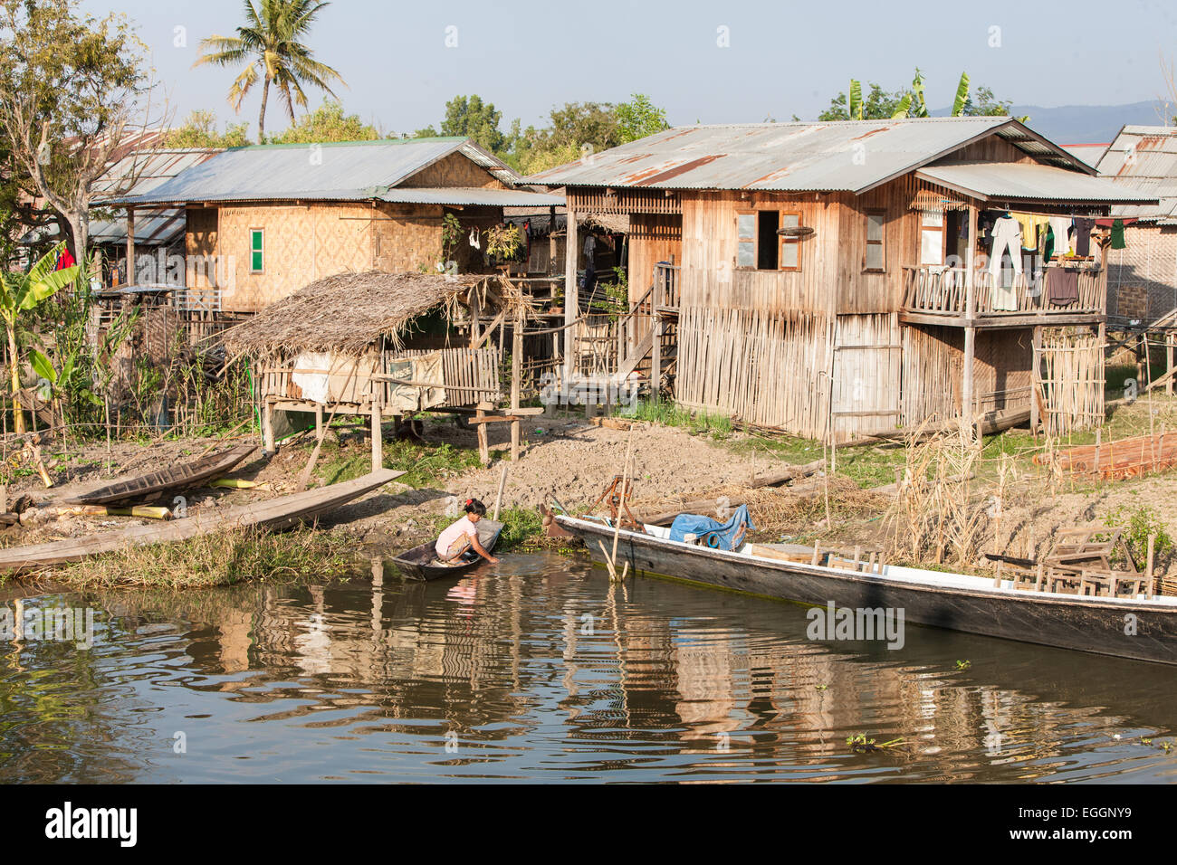 Basic simple houses on canal waterway near main town of Nyaungshwe town on banks of Inle Lake,Burma,Myanmar, Stock Photo