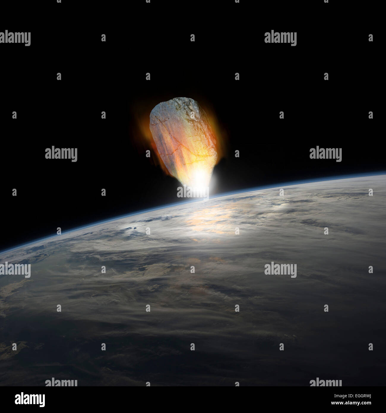 A massive asteroid, glowing white hot, enters Earth's atmosphere moments before impact with the planet. Stock Photo