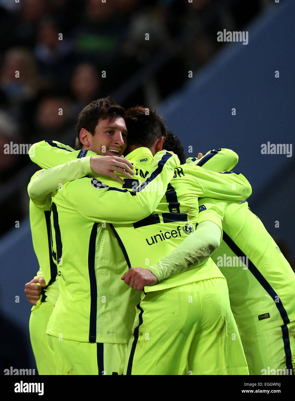 Manchester, Britain. 24th Feb, 2015. Players of Barcelona celebrate their teammate Luis Suarez's second goal during the UEFA Champions league Round of 16 first leg match between Manchester City and Barcelona at Etihad Stadium in Manchester, Britain, on Feb. 24, 2015. Barcelona won 2-1. Credit:  Han Yan/Xinhua/Alamy Live News Stock Photo