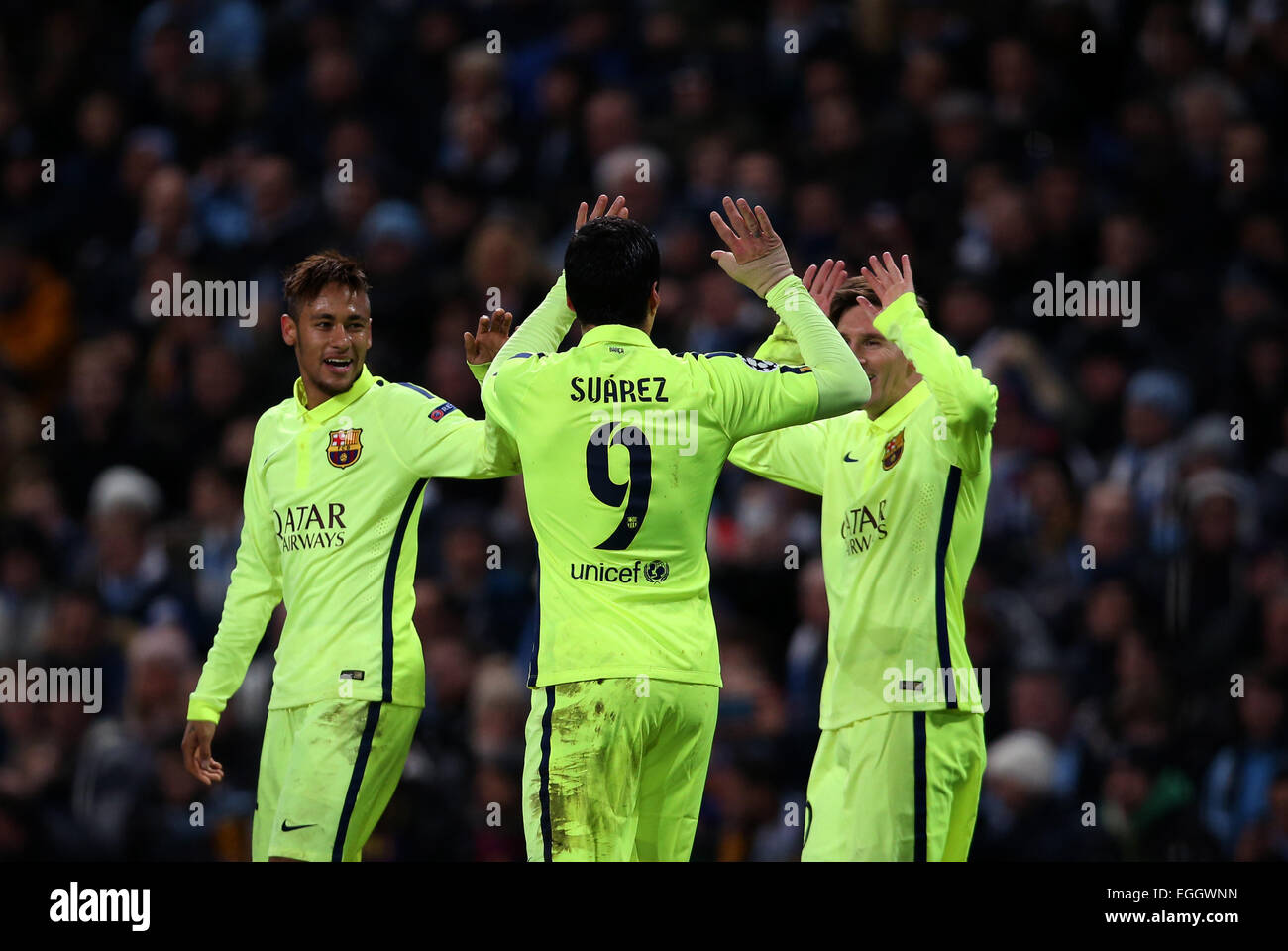 Manchester, Britain. 24th Feb, 2015. Neymar (L) and Lionel Messi (R) of Barcelona celebrate their teammate Luis Suarez's second goal during the UEFA Champions league Round of 16 first leg match between Manchester City and Barcelona at Etihad Stadium in Manchester, Britain, on Feb. 24, 2015. Barcelona won 2-1. Credit:  Han Yan/Xinhua/Alamy Live News Stock Photo