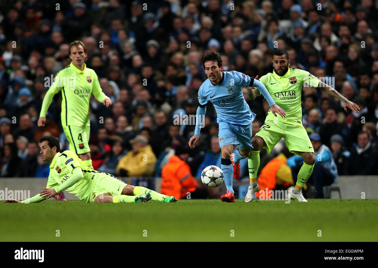 Manchester, Britain. 24th Feb, 2015. David Silva (2nd R) of Manchester City breaks through during the UEFA Champions league Round of 16 first leg match between Manchester City and Barcelona at Etihad Stadium in Manchester, Britain, on Feb. 24, 2015. Barcelona won 2-1. Credit:  Han Yan/Xinhua/Alamy Live News Stock Photo