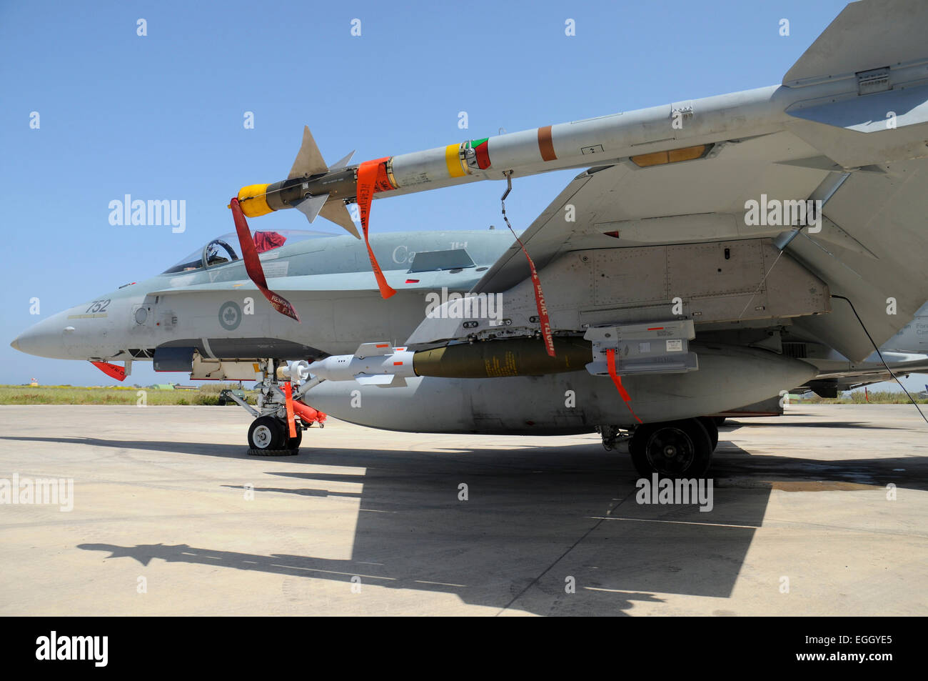 AIM-9L Sidewinder missile and GBU-12 Laser-Guided Bomb loaded on a Royal Canadian Air Force CF-18 Hornet on the airbase at Trapa Stock Photo