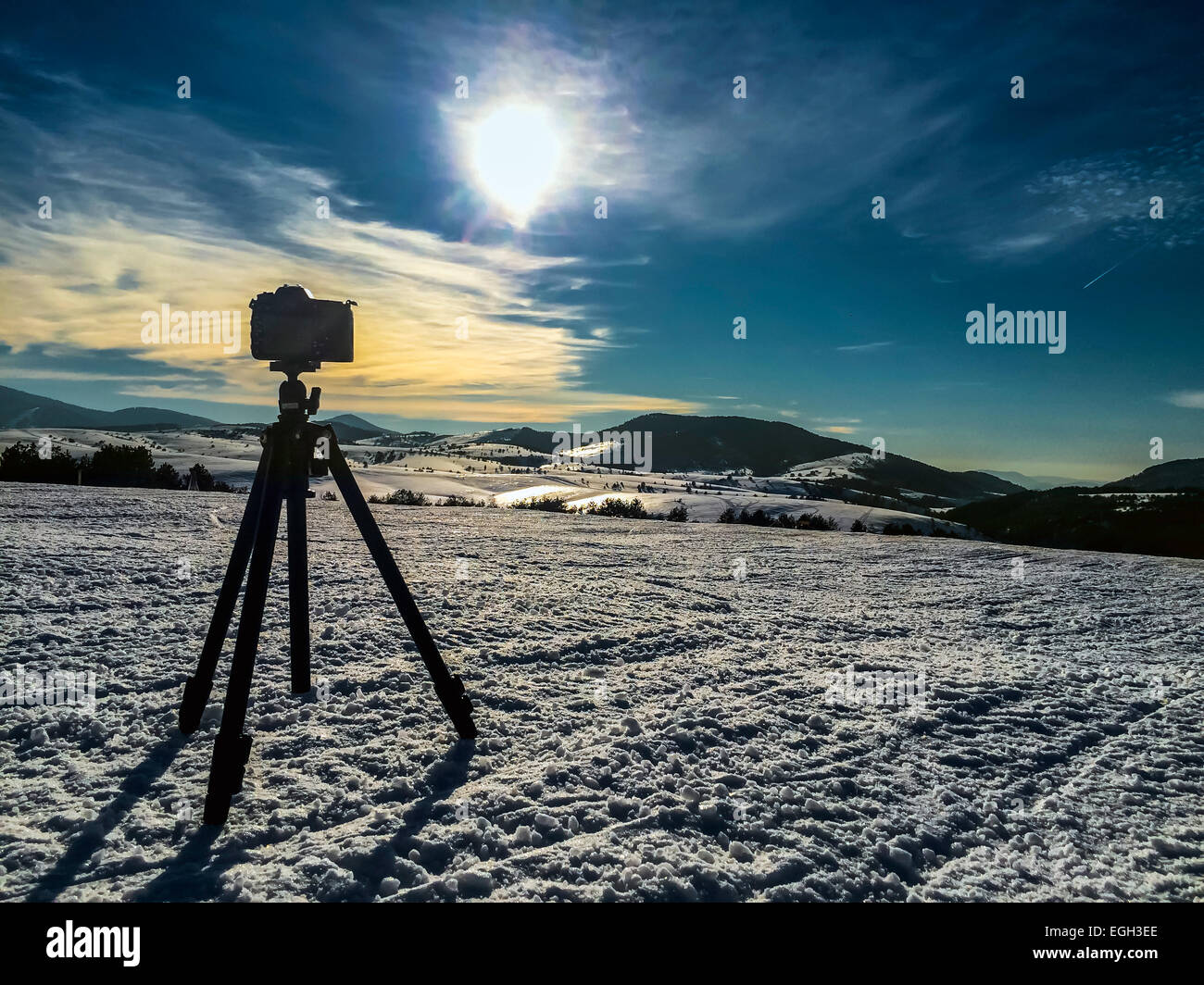 Camera on tripod shooting mountin landscape in winter time Stock Photo ...