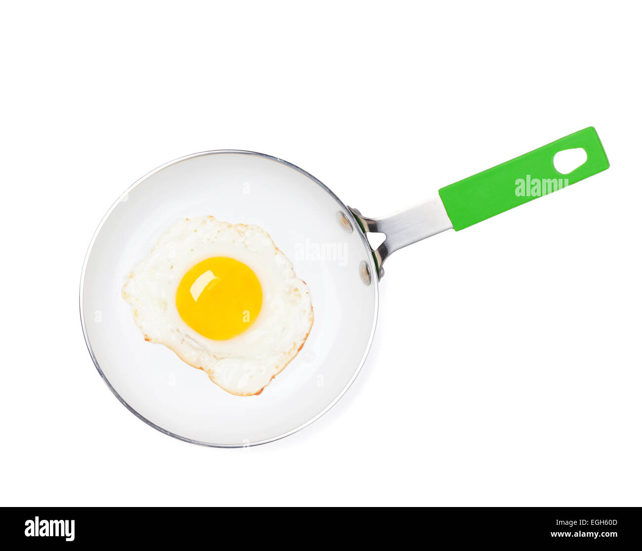Fried egg in a frying pan. Isolated on white background Stock Photo