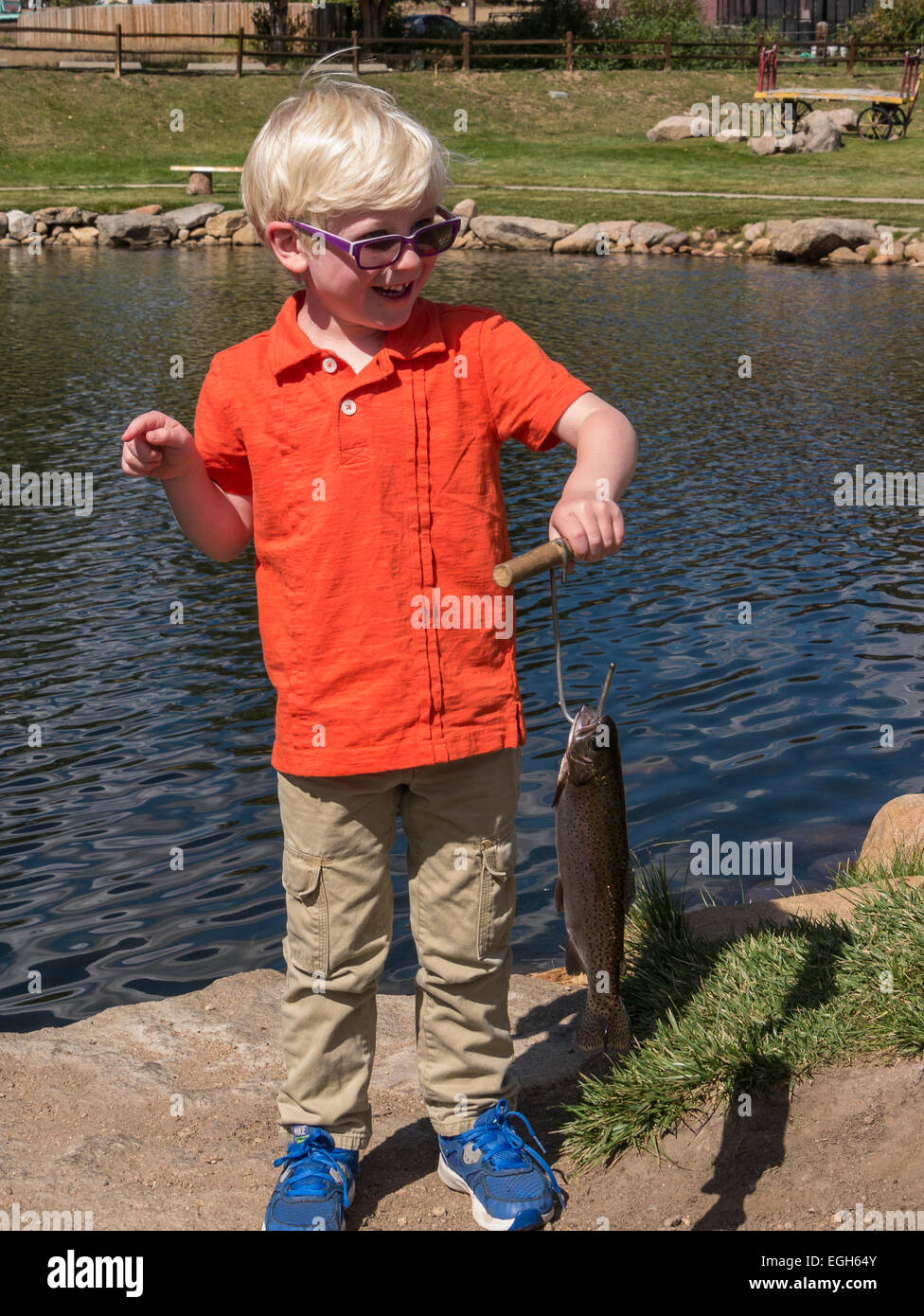 Young boy displays his catch from the pond at Trout Haven, Estes Park, Colorado Stock Photo Alamy