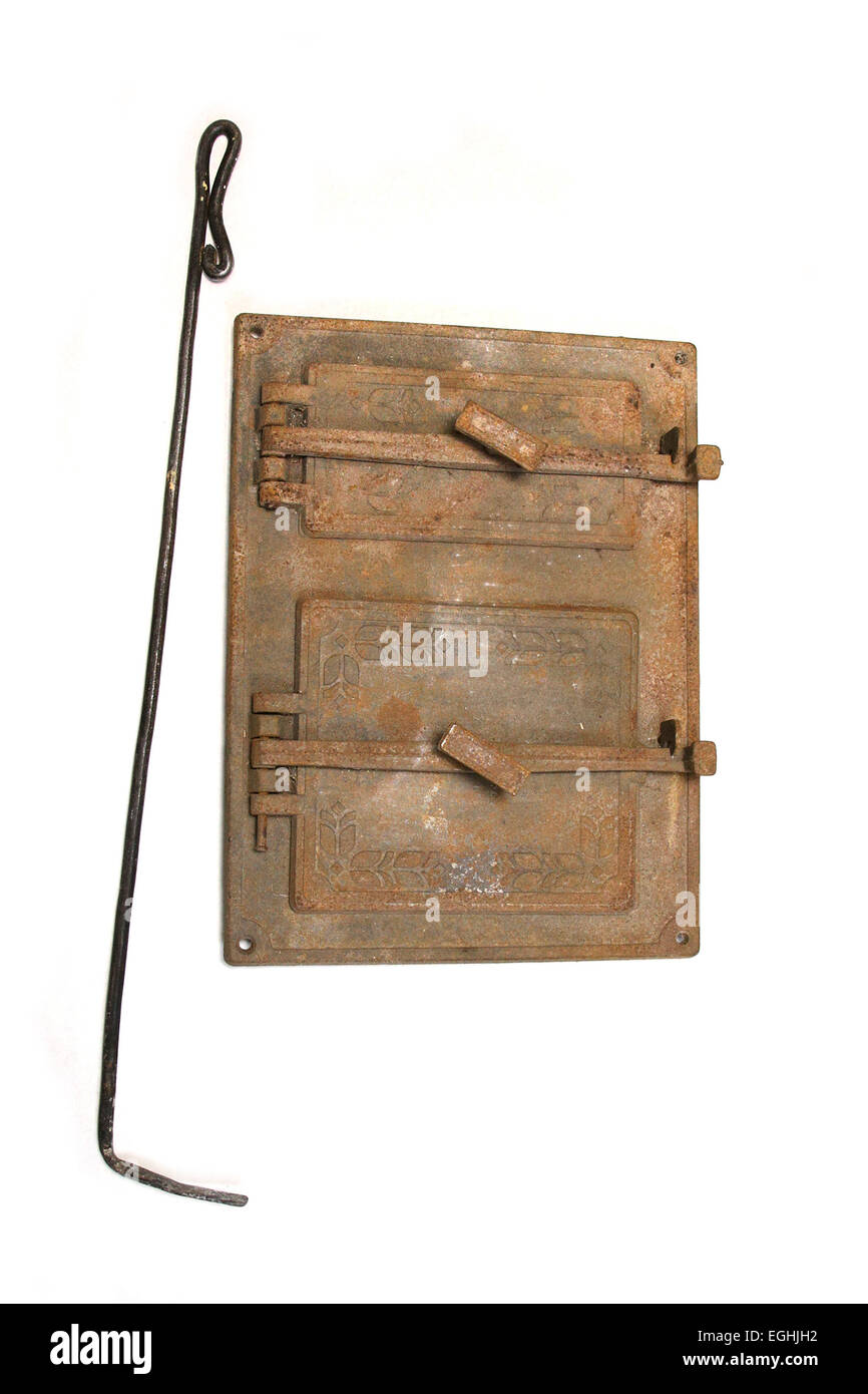 Vintage Stove Door And Fireplace Irons On White Stock Photo