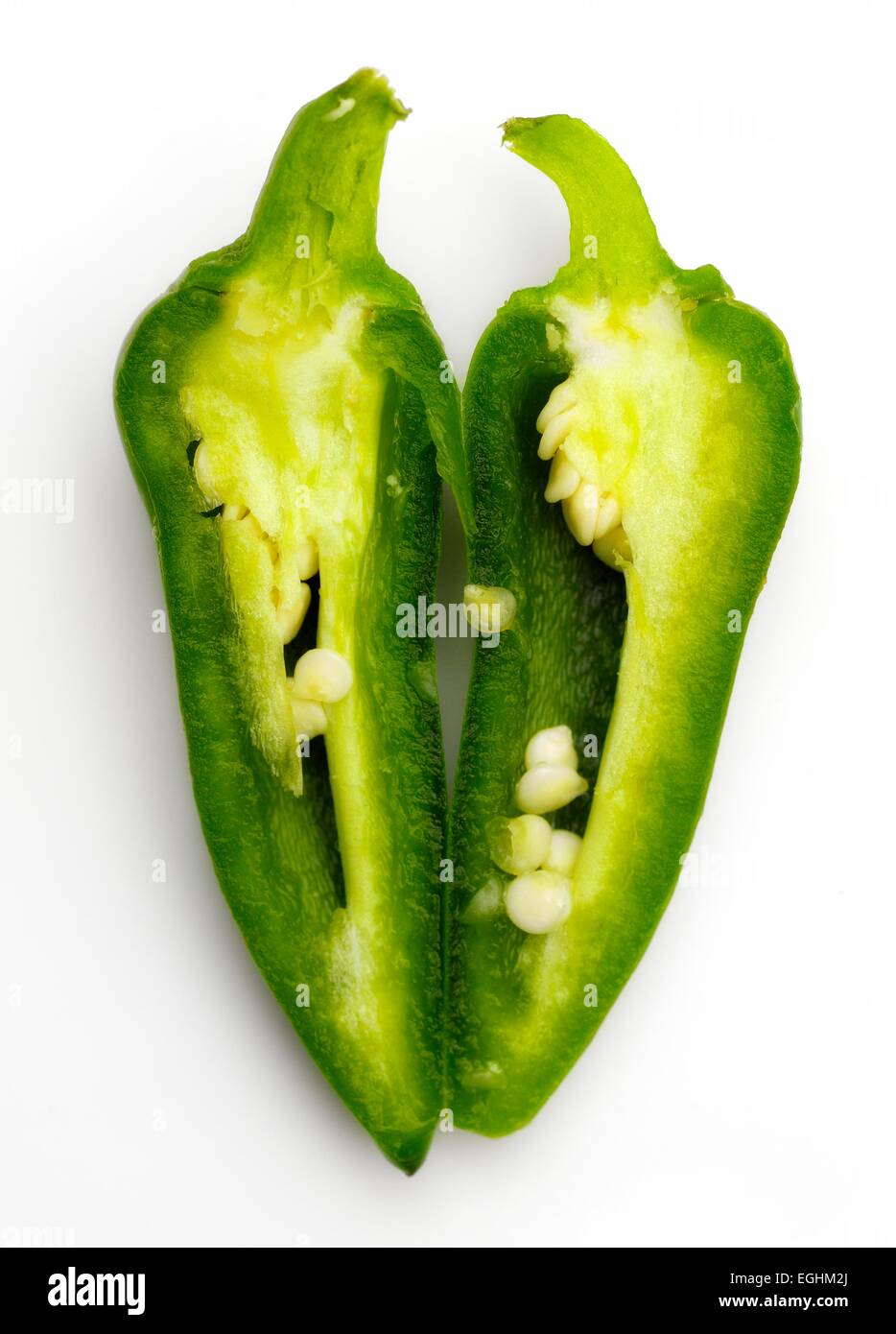 A green chili pepper cut in half Stock Photo