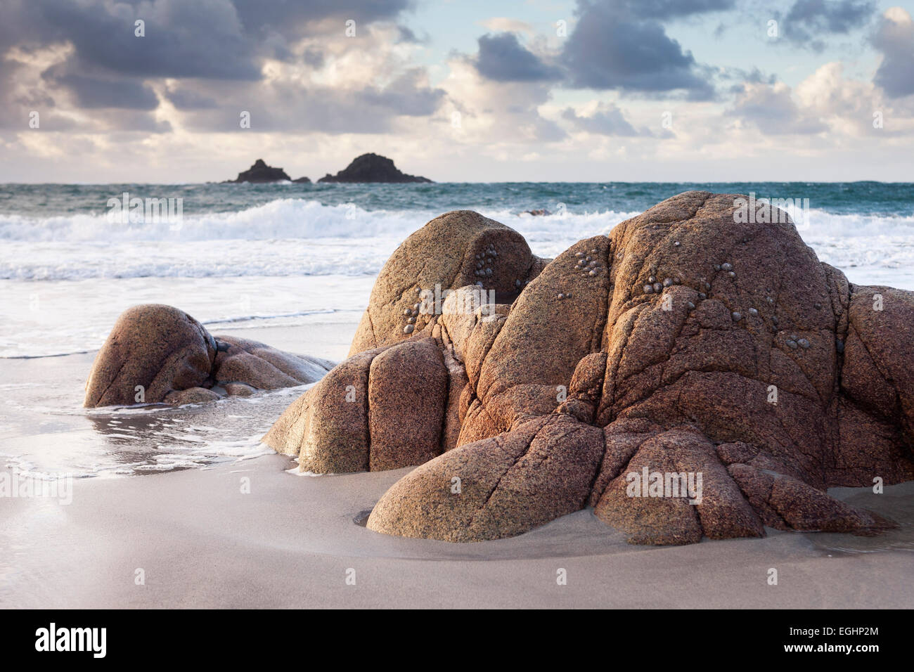 Granite rocks on Cornish beach with ocean view to the Brisons, 'Porth Nanven', 'Cot Valley', Cornwall, England, UK Stock Photo
