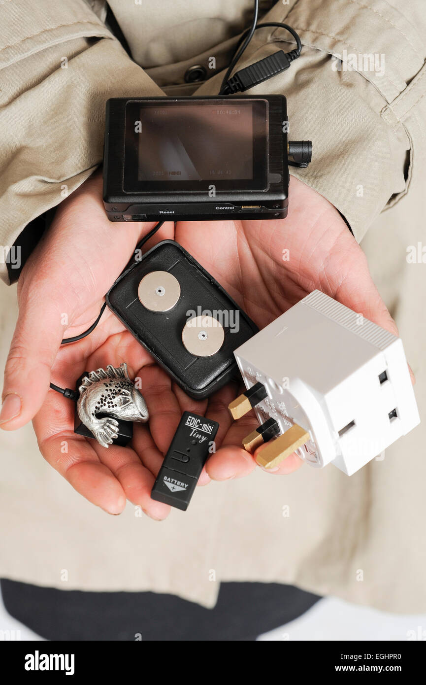 A handful of spy equipment including a camera, voice recorder and car  tracker Stock Photo - Alamy