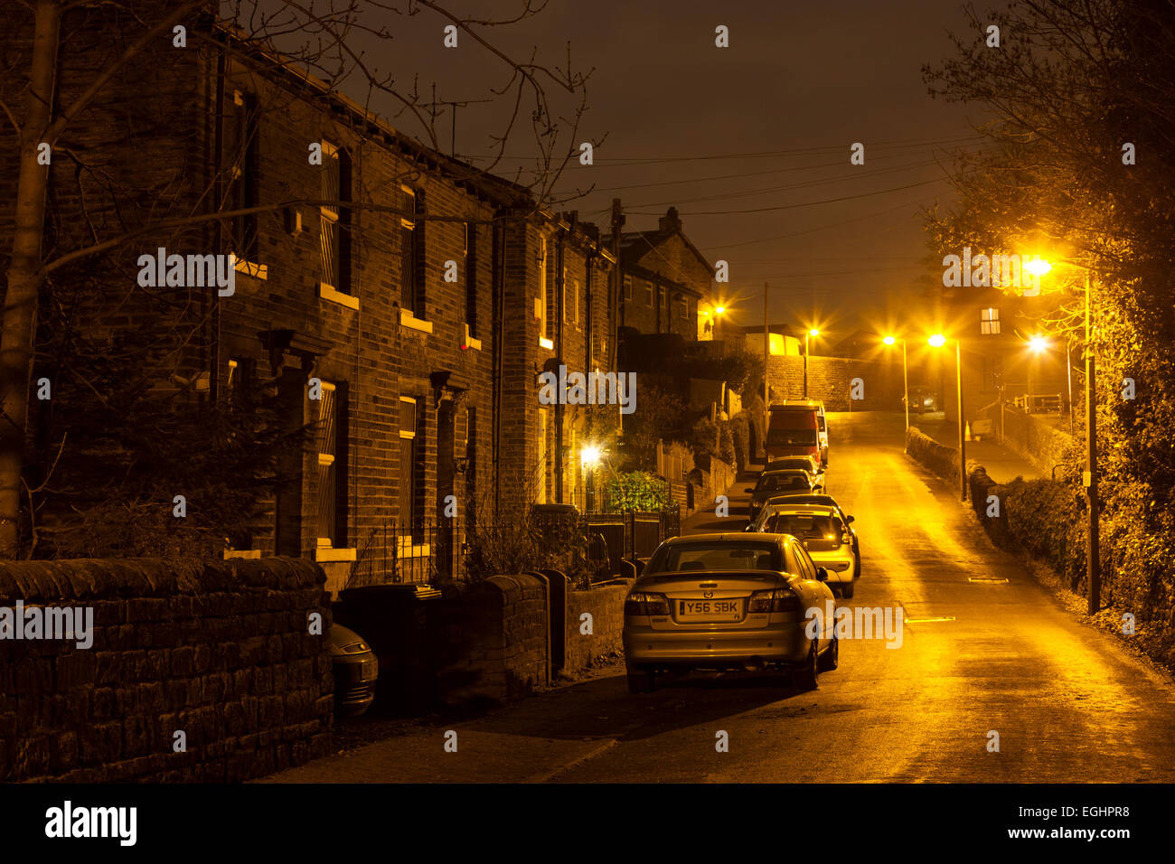 Street with parked cars at night, Sowerby Bridge, West Yorkshire Stock Photo