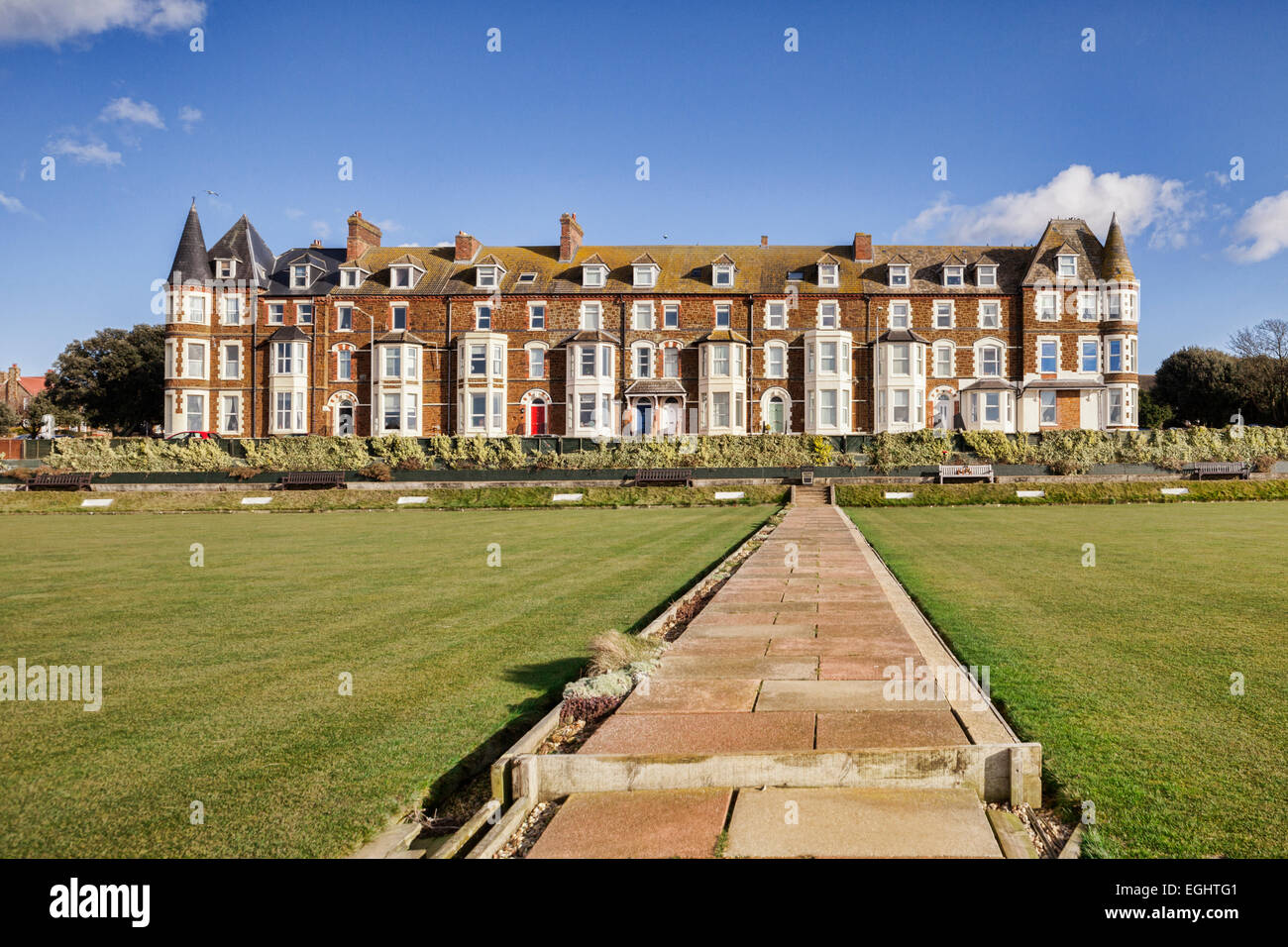 Cliff Parade bowling green and terrace of houses at Hunstanton, Norfolk. Stock Photo