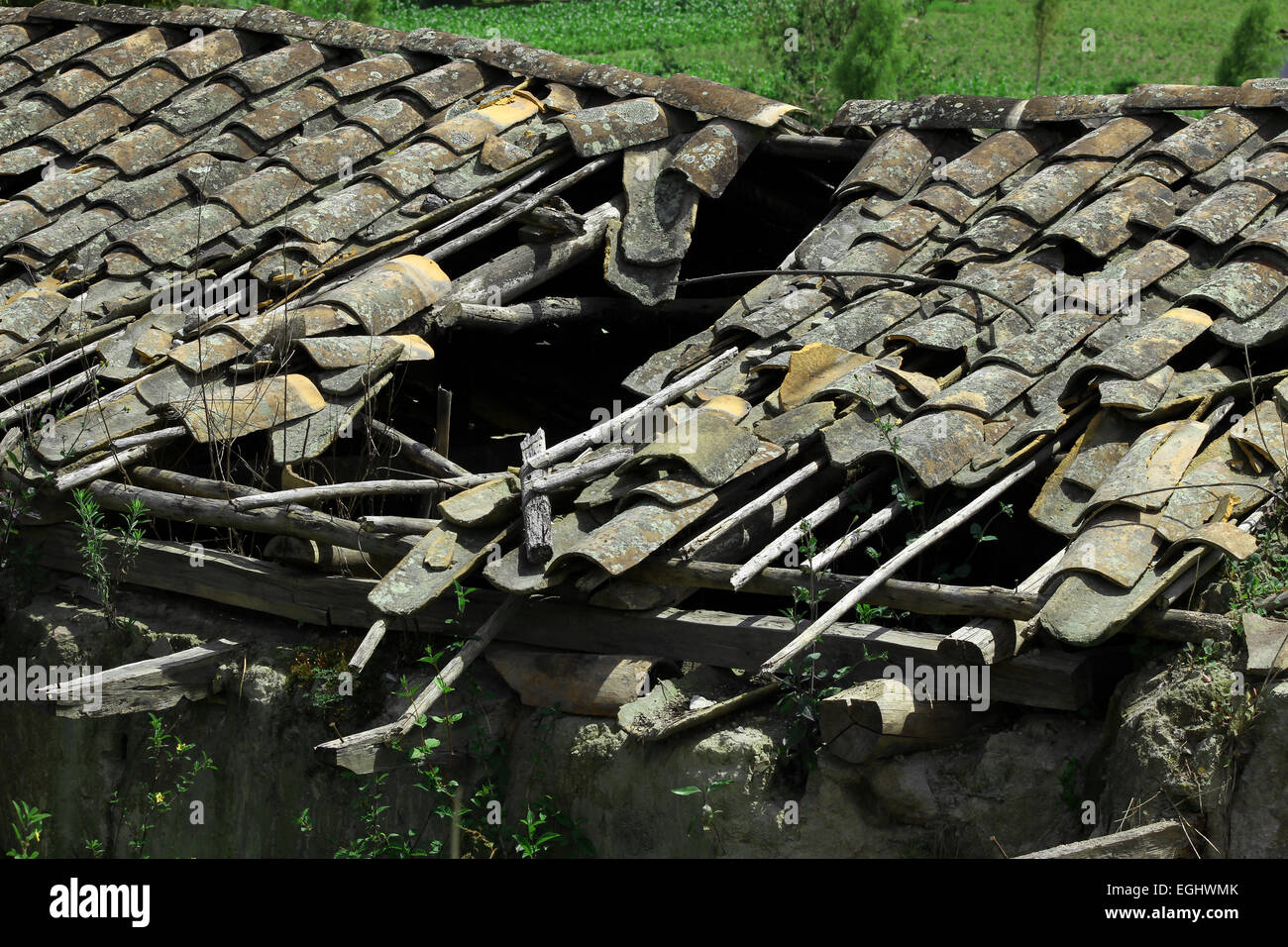 A roof with broken terracotta shingles in a building in Cotacachi, Ecuador Stock Photo