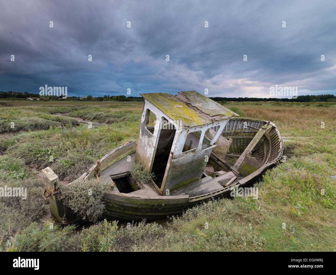 An old boat on the Saltmarshes at Thornham, Norfolk, England. Stock Photo