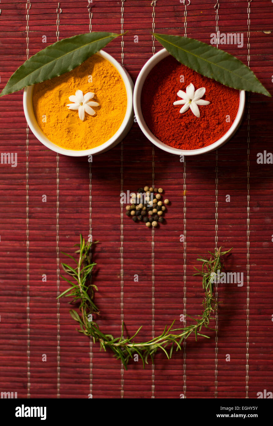 Happy face composed with spices and herbs. Stock Photo