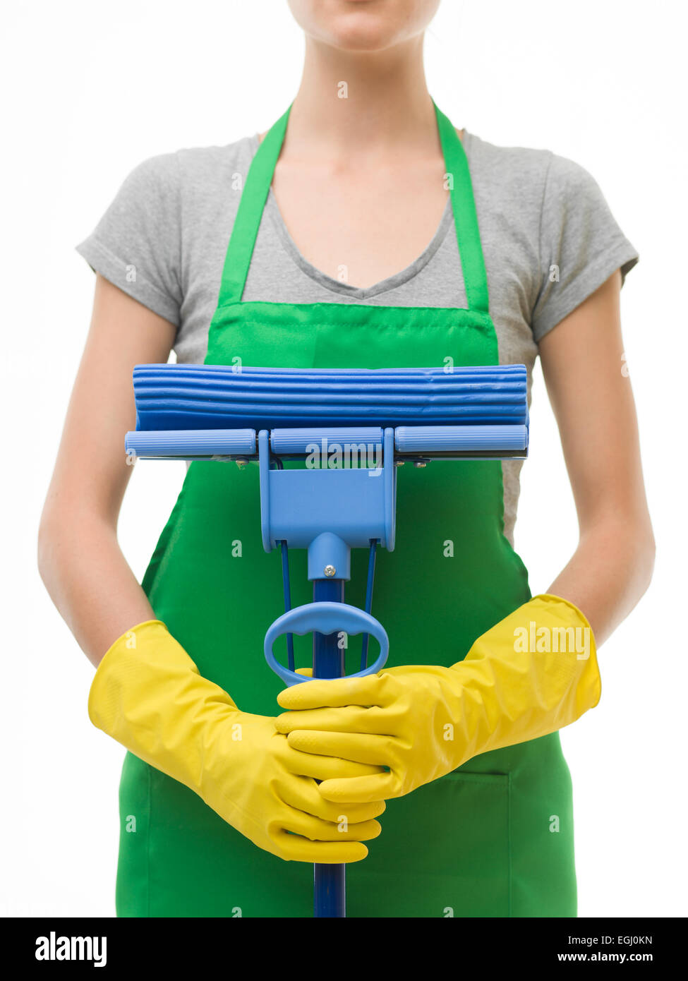 closeup of cleaning lady holding mop in front of her, on white