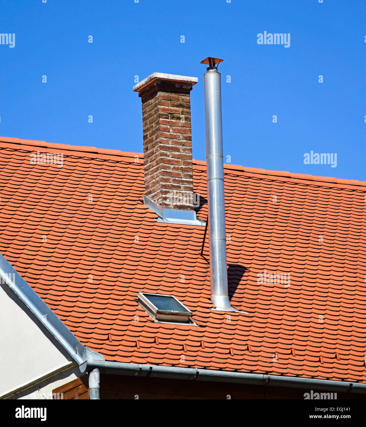 Smoke stacks on the roof of a building Stock Photo Alamy